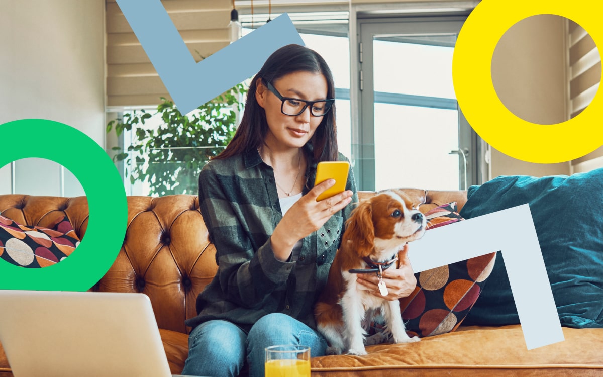 Woman on a mobile device working from home