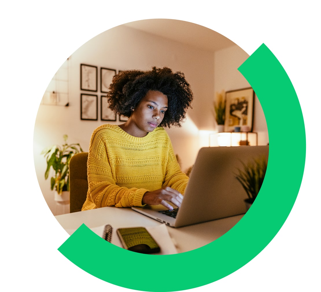 Woman looking focused while using Go To Meeting on their laptop.