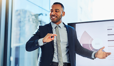 Man in business suit giving presentation with slideshow in office with glass door